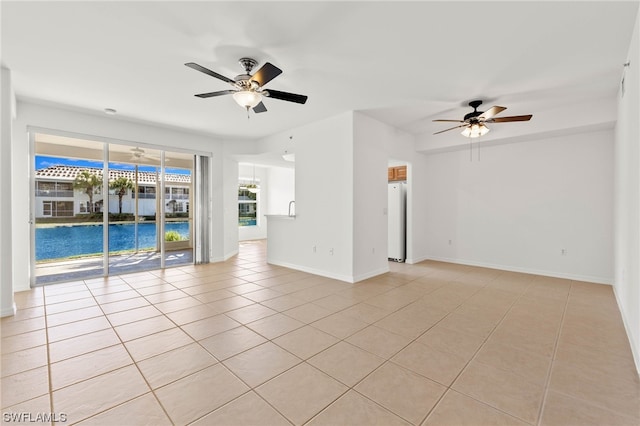 interior space featuring light tile flooring and ceiling fan