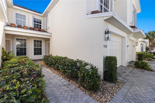 view of side of home featuring a garage