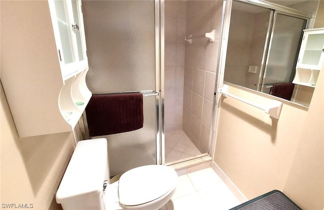 bathroom with toilet, a shower with door, and tile patterned flooring