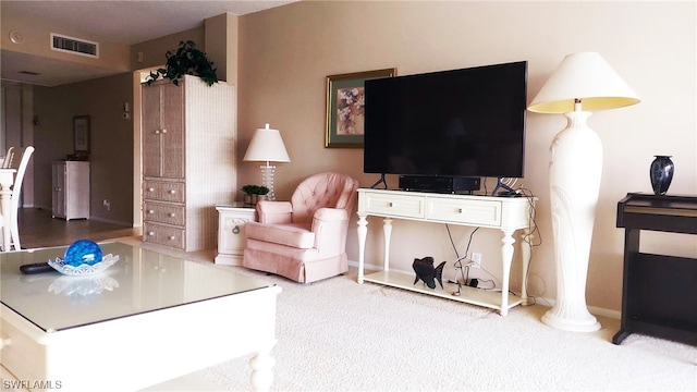 living room with light colored carpet