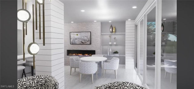 dining area featuring a fireplace