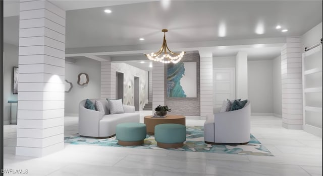 interior space with a barn door, an inviting chandelier, and ornate columns