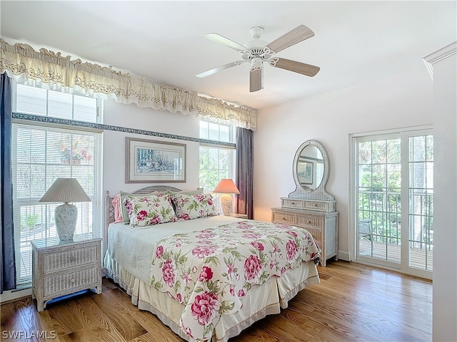 bedroom featuring ceiling fan, access to outside, and hardwood / wood-style flooring