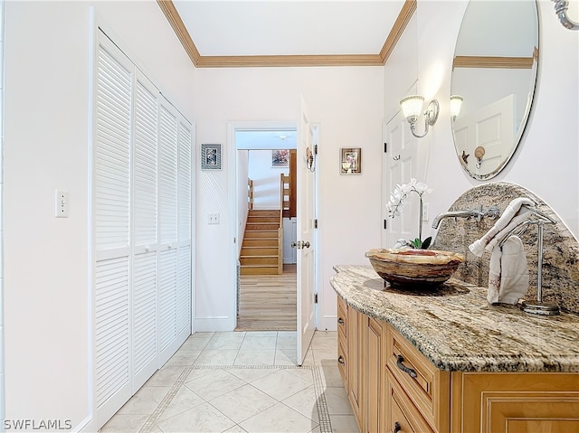 bathroom featuring vanity, crown molding, and hardwood / wood-style floors