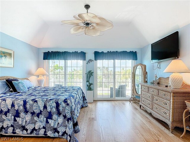 bedroom with light hardwood / wood-style floors, multiple windows, access to exterior, and ceiling fan