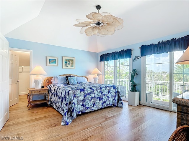 bedroom with multiple windows, access to exterior, light wood-type flooring, and ceiling fan