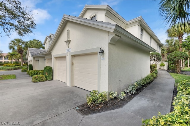 view of side of property with a garage