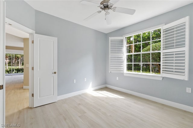 unfurnished room with ceiling fan, a healthy amount of sunlight, and light hardwood / wood-style floors