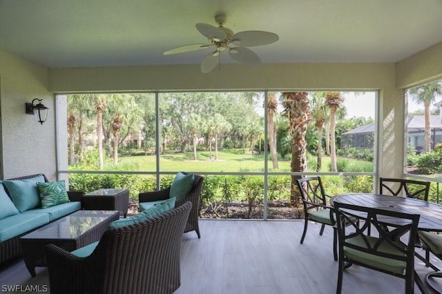 sunroom / solarium with ceiling fan