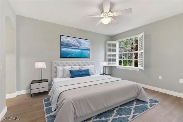 bedroom featuring ceiling fan and light hardwood / wood-style flooring