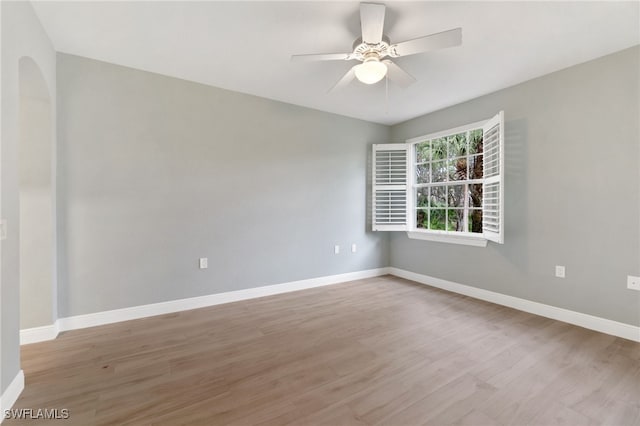 spare room with ceiling fan and light hardwood / wood-style floors