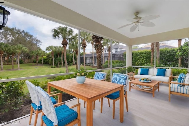 sunroom / solarium with ceiling fan