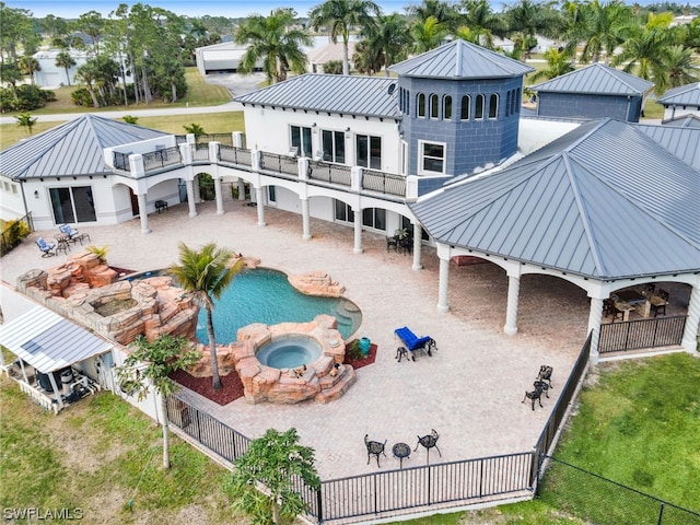 rear view of house with a yard and a patio area