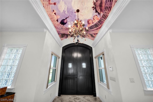 foyer entrance featuring crown molding, an inviting chandelier, and light tile floors