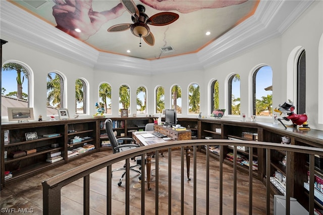 miscellaneous room with dark tile flooring, ornamental molding, ceiling fan, and a tray ceiling