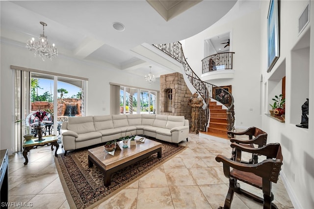 living room with coffered ceiling, a high ceiling, light tile floors, and ceiling fan with notable chandelier