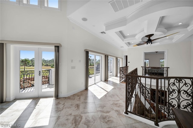 hallway with coffered ceiling, beam ceiling, light tile flooring, french doors, and crown molding