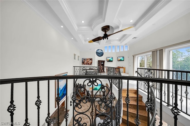 hallway with coffered ceiling, ornamental molding, hardwood / wood-style flooring, and beam ceiling