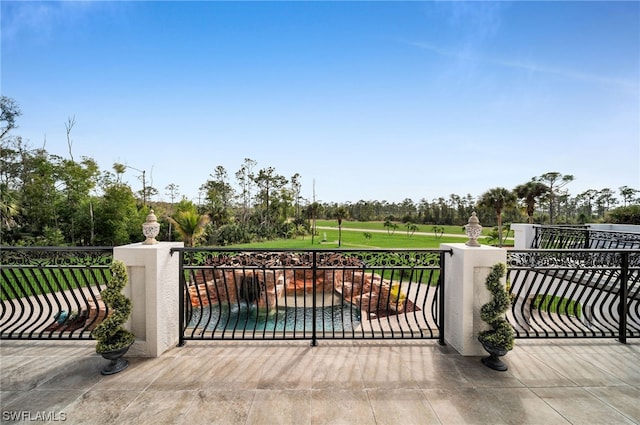 view of gate featuring a lawn