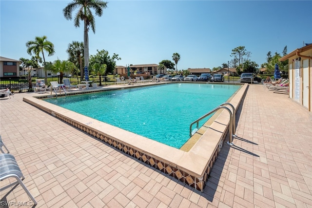 view of swimming pool with a patio