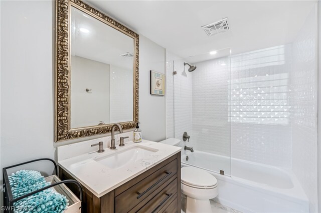 full bathroom with vanity, enclosed tub / shower combo, and toilet