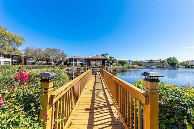 dock area with a gazebo and a water view