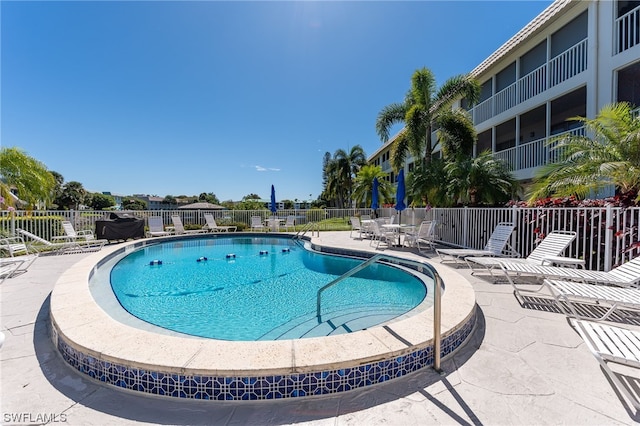 view of pool featuring a patio area