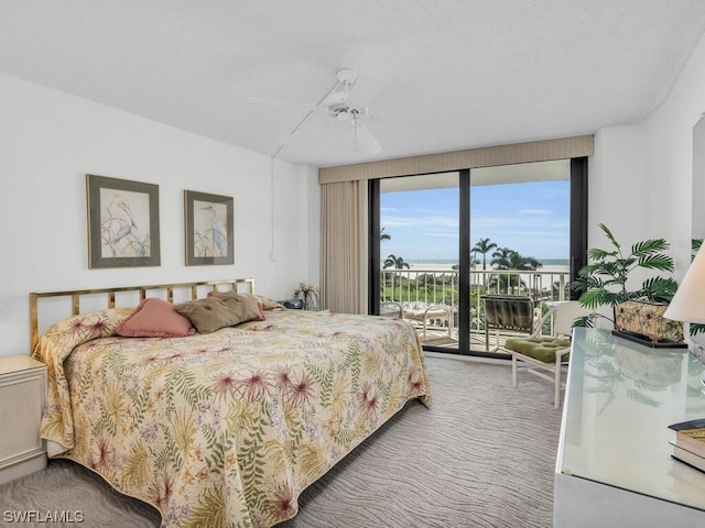 carpeted bedroom featuring access to outside and ceiling fan