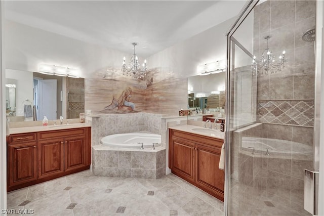 bathroom featuring tile patterned floors, vanity, and an inviting chandelier