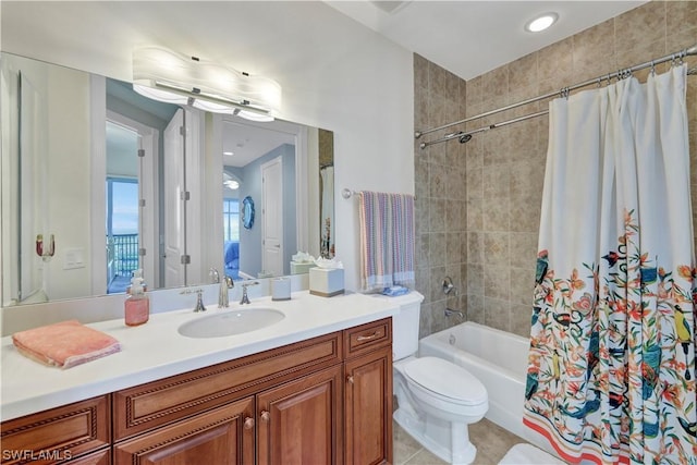 full bathroom with tile patterned flooring, shower / bath combo, vanity, and toilet