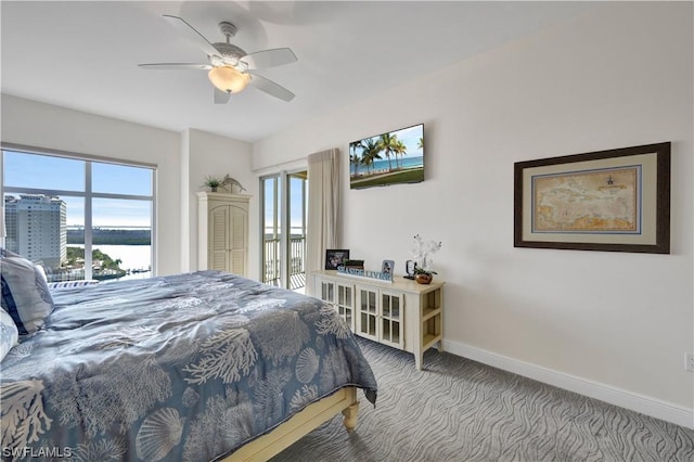 carpeted bedroom with ceiling fan