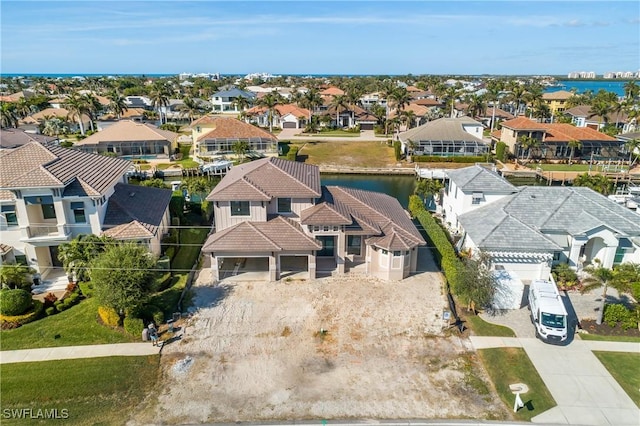 birds eye view of property featuring a water view