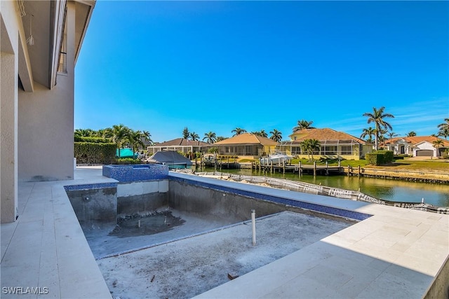 view of swimming pool featuring a water view