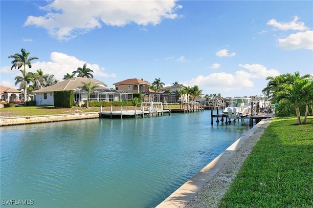 exterior space featuring a residential view, a water view, and a yard