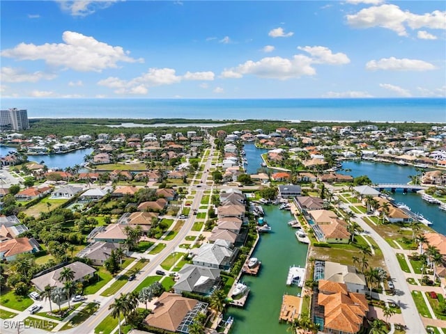 birds eye view of property with a residential view and a water view