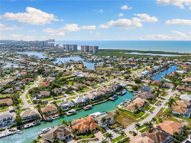 aerial view with a residential view, a water view, and a city view