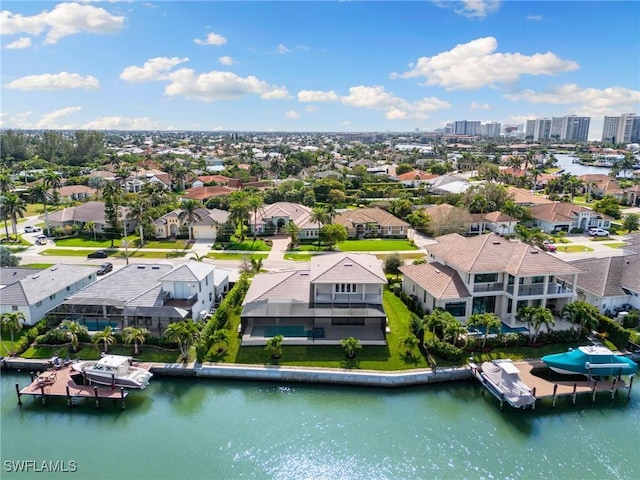 aerial view with a water view and a residential view