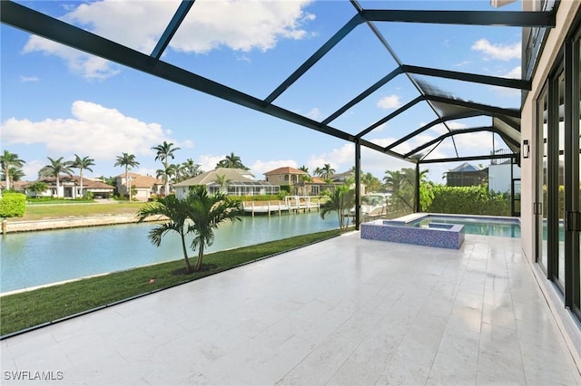 view of patio / terrace featuring a water view, a pool with connected hot tub, a lanai, and a residential view