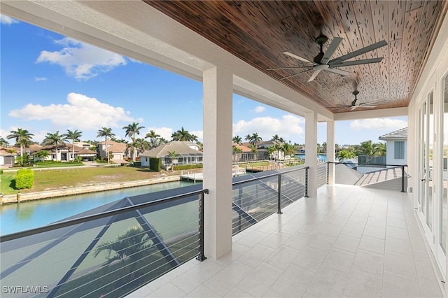 balcony featuring ceiling fan and a residential view