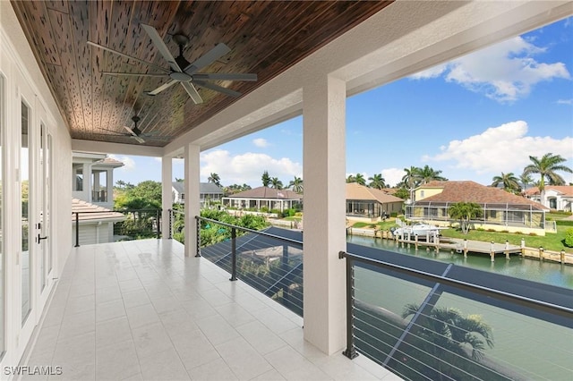 balcony with a water view and a residential view