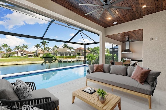 outdoor pool featuring a residential view, a water view, a lanai, a patio area, and outdoor lounge area