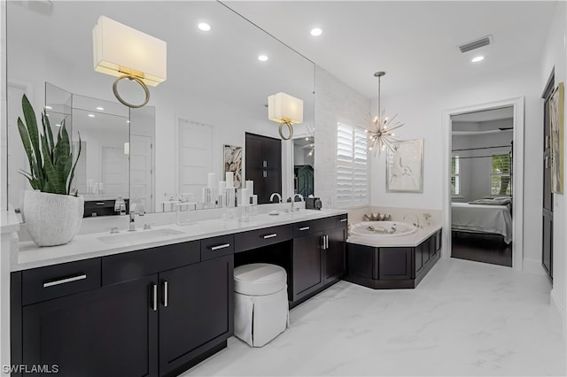 bathroom featuring tile floors, a bath, and double vanity