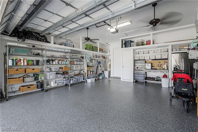 garage with ceiling fan, a workshop area, and a garage door opener