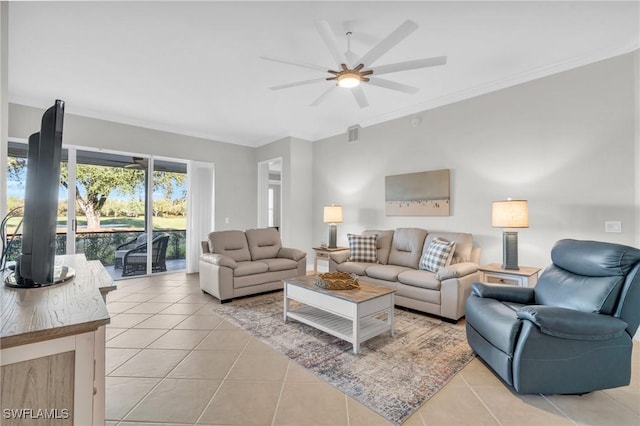 living room with ceiling fan, light tile patterned floors, and ornamental molding