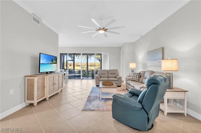 living room featuring ceiling fan, light tile patterned floors, and ornamental molding