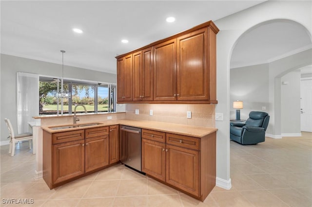 kitchen featuring dishwasher, light tile patterned floors, decorative light fixtures, and sink