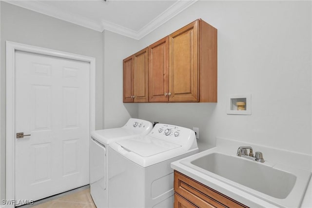 clothes washing area with sink, cabinets, washer and clothes dryer, light tile patterned floors, and ornamental molding