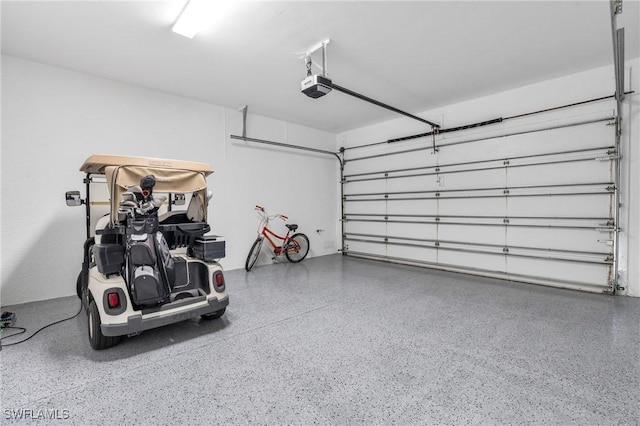 garage featuring a garage door opener