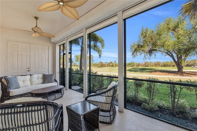 sunroom featuring ceiling fan