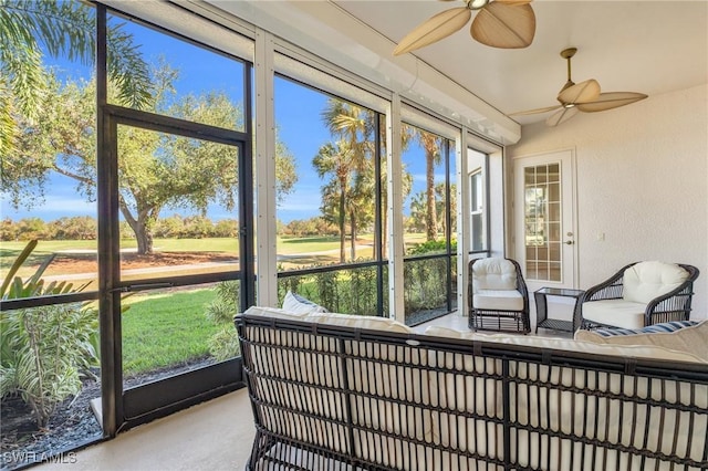 sunroom / solarium with ceiling fan and a wealth of natural light